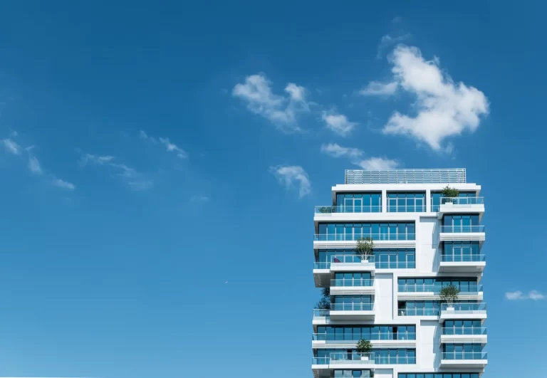 low-angle-view-modern-apartment-building-against-sky