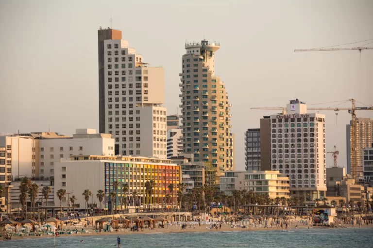 buildings-by-sea-against-sky-city